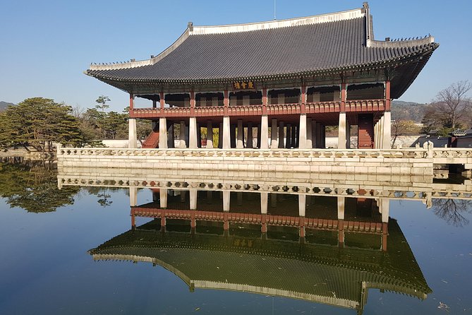 Best Walking Tour to Gyeongbok Palace Bukchon Hanok Village - Between palace landmarks: Gwanghwamun and the King Sejong Statue stop