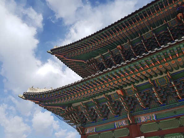 Seoul: Gyeongbok Palace, Bukchon Village, and Gwangjang Tour - Stop 2: Bukchon Hanok Village for hanok photos without the maze stress