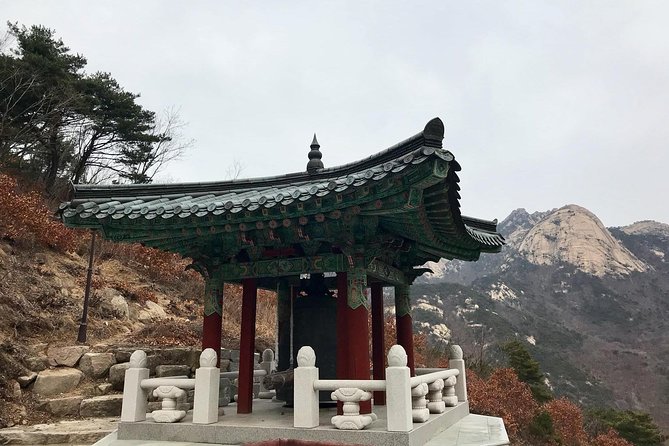 Seoul Mountain Hike: Temples, Folklore & Traditional Meal - Temple stop on the descent: a calm pause in rugged settings