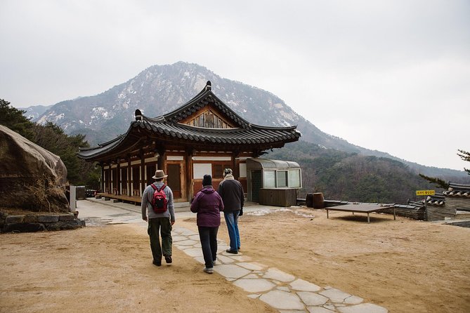 Seoul Mountain Hike: Temples, Folklore & Traditional Meal - Getting to the trail: Gupabal Station, a short bus ride, and a warm-up